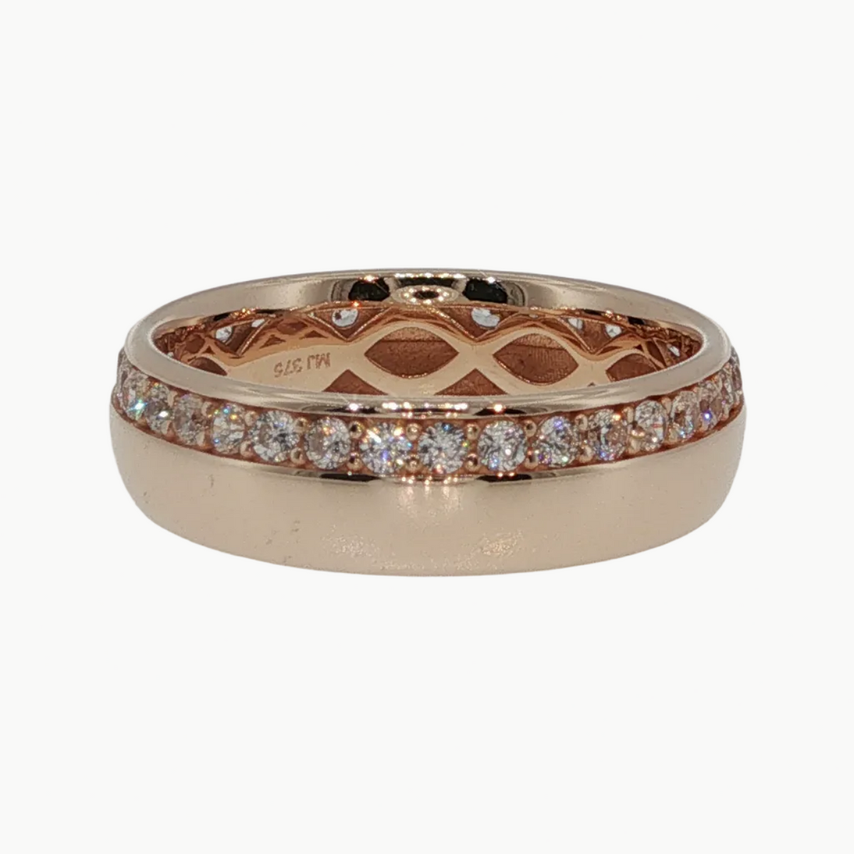 A rose gold eternity ring featuring a pavé diamond band and an openwork lattice interior, shown on a clean white reflective surface.