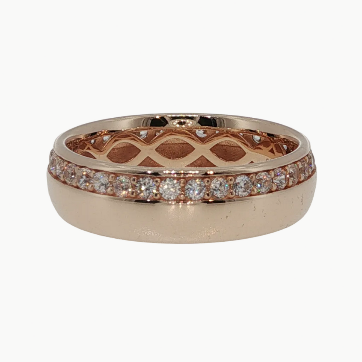 A rose gold eternity ring featuring a textured geometric lattice pattern on the band and a channel-set row of small clear stones along the front, displayed on a clean white reflective surface.