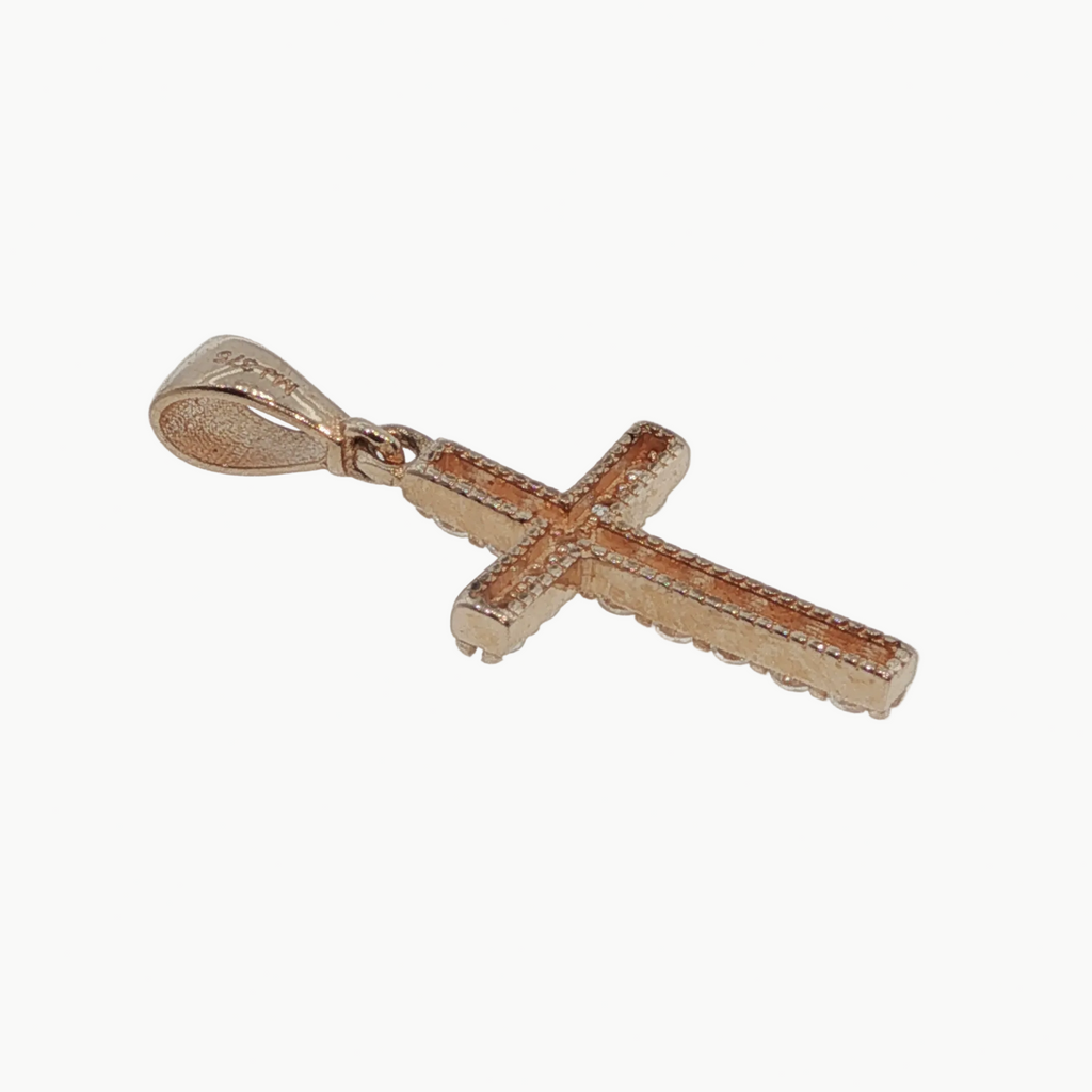 A small cross pendant in rose gold with a textured, diamond-paved appearance, shown on a plain light gray background.