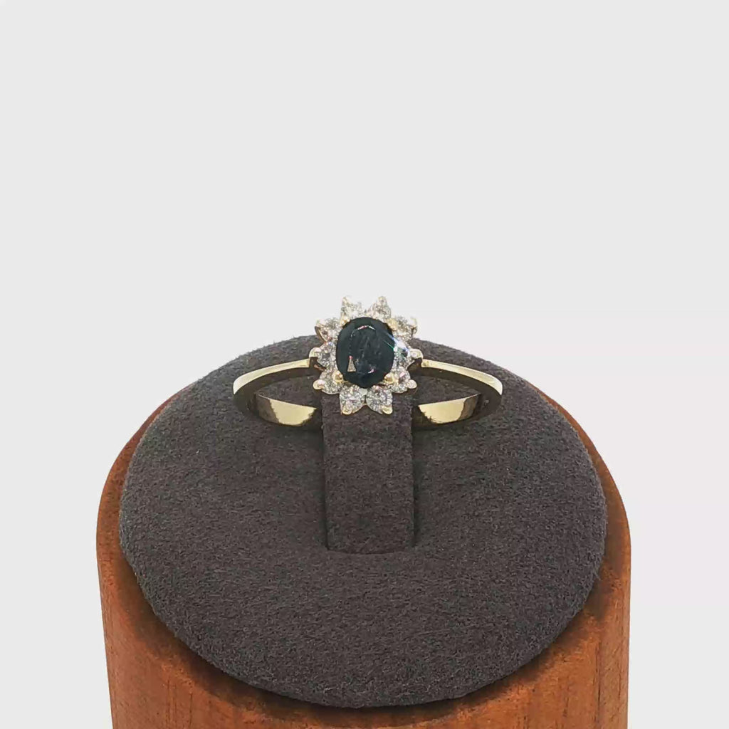 Deep Blue Sapphire Halo Ring in Yellow Gold